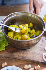 Delicious steamed vegetables in cooking pot to save all useful vitamins. Eggplant, cauliflower, new potato, onion with turmeric, spices and herbs. Lunch or dinner. Raw vegan vegetarian healthy food