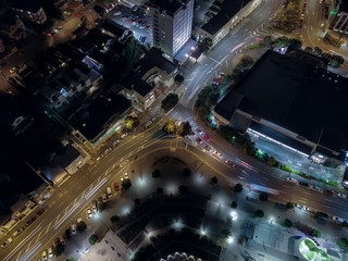 Aerial, Car Light Streaks Around Small Roundabout 