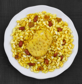 Indian Street Spicy Food Bhel puri is a savoury snack, and is also a type of chaat. It is made of puffed rice, vegetables and a tangy tamarind sauce.