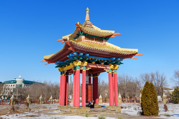 Prayer wheel inside the pagoda in Buddhist complex Golden Abode of Buddha Shakyamuni in spring. Elista. Russia