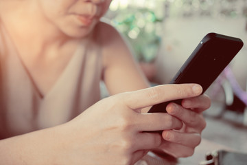 close up hand typing smartphone with copy space for text, shopping online, sending email, play phone