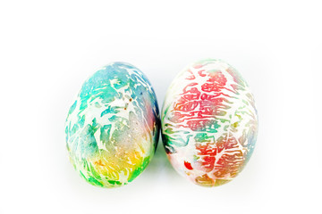 multicolored eggs on white background