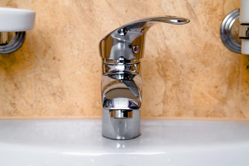 Steel bathroom faucet and ceramic wash basin 