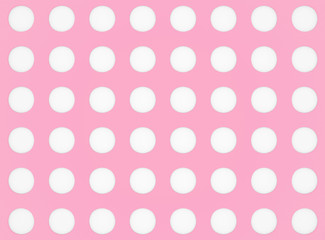 Sweet white circle dots pattern on pink background.