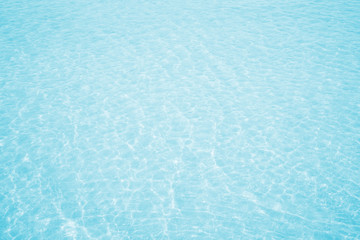 Water cool sea beach texture background on horizon tropical sandy; relaxing outdoors vacation with touching sunshine, sky surf summer clouds and light blue wave ocean.