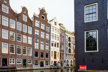 Fototapeta premium Amsterdam canals and typical dutch houses in capital of Netherlands, Europe