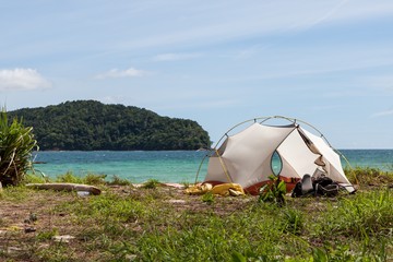 Camping on a beach of an uninhabited island. Tropical jungles landscape, blue sea water and paradise beach camping. Exotic location for camping on beach. Version 2.