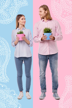 Eco lifestyle. Cheerful romantic couple of eco activists kindly looking at each other while holding lovely flower pots