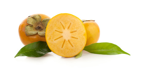 Tropical fruit persimmon. Kaki with leaves on white background.