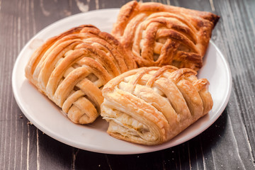 Cookies and sweet pastries with cross wired lines in white plate