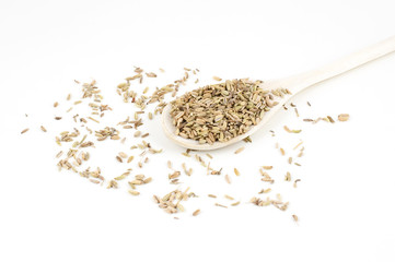 aniseed on wooden spoon isolated on white background