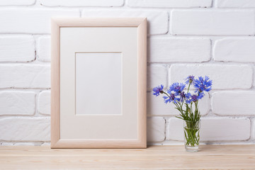 Wooden frame mockup with cornflower