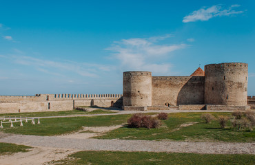 Fototapeta na wymiar Old fortress tower stone walls Europe sky