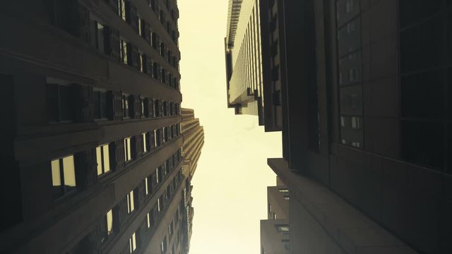 Low Angle Gliding Shot made Between Modern Buildings in the New York City Done in POV dolly style. Shot on RED Epic 4K UHD Camera.