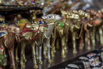 Colorful, camel shaped trinkets, for sale in the souks in Dubai, UAE