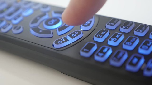 Channel changing on IR remote control close-up video