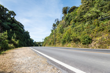 Country road on the mountain with blue sky in sunshine day.
