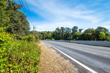Country road on the mountain with blue sky in sunny day.