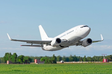 Passenger plane without landing gear flying very low pass over the runway at the airport