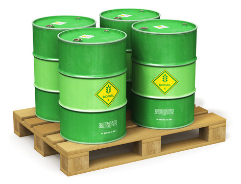 Group of green biofuel drums on shipping pallet isolated on white