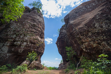 Beautiful scenery of the sandstone gate in the jungle with blue sky background, Phu Sing, Bueng Kan, Thailand