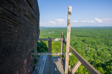 Beautiful scenery of  wooden pathway along the cliff with blue sky background, Phu Thok, Bueng Kan, Thailand