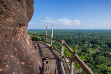 Beautiful scenery of  wooden pathway along the cliff with blue sky and wild in the background, Phu Thok, Bueng Kan, Thailand