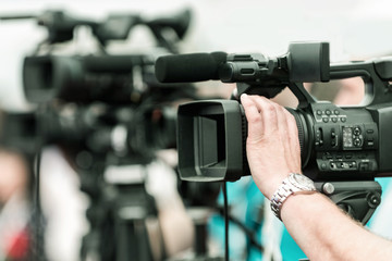 Camera at media conference