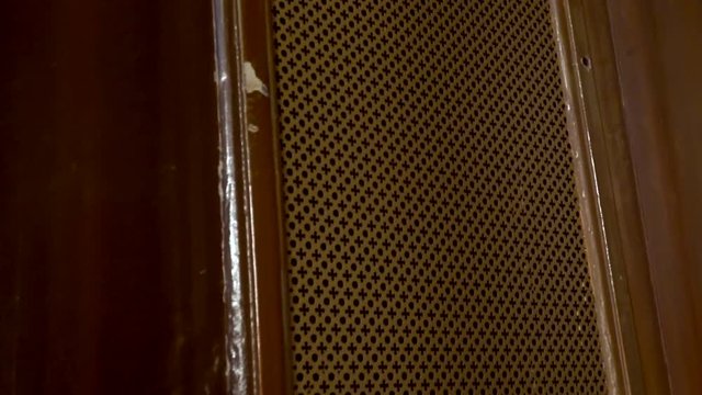 cinematic shot moving to wood confessional in church