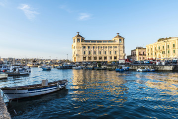 Fototapeta na wymiar Fishing and recreational boats docked in Siracusa, Sicily, Italy