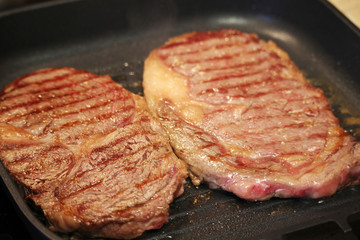 Two steaks cooked on the pan