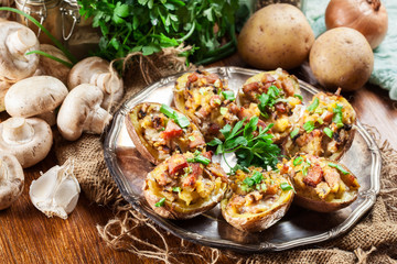 Baked potatoes stuffed with bacon, mushrooms and cheese