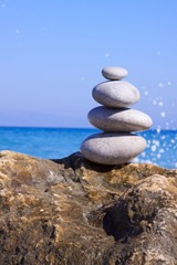 Fototapeta na wymiar Spa stones balance on beach .