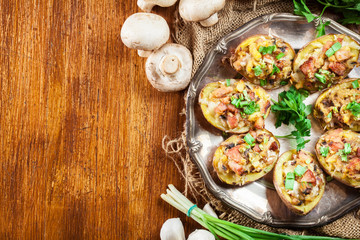 Baked potatoes stuffed with bacon, mushrooms and cheese