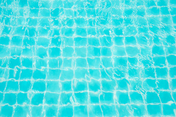Fototapeta na wymiar Abstract image surface of blue swimming pool water for background textured usage.