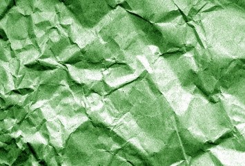 Old paper with wrinckles in green tone.