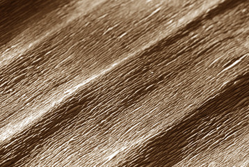 Crepe paper with blur effect in brown color.