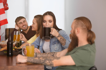Friends with beer in sport bar