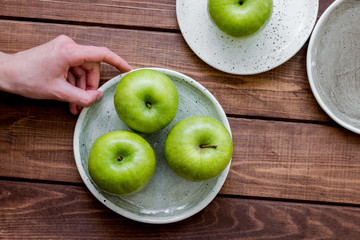 ripe green apples wooden table background top view