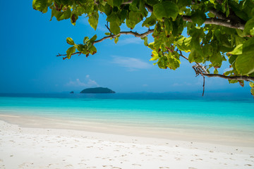 Fototapeta na wymiar Beautiful tropical island white sand beach blue sky sunny day - Summer breeze travel holiday