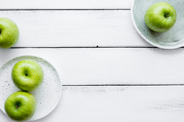 ripe green apples white table background top view space for text
