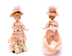 Porcelain doll in vintage dress and hat, front and back view