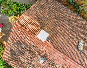 Overflight of the roof of a single-family house to check the condition of the roof tiles, aerial...
