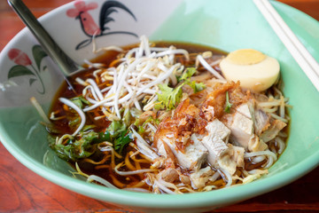 Crispy Pork noodles with egg in big bowl