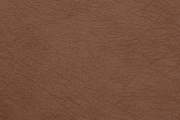 Light brown leather texture surface. Close-up of natural grain cow leather Light brown leather texture surface.