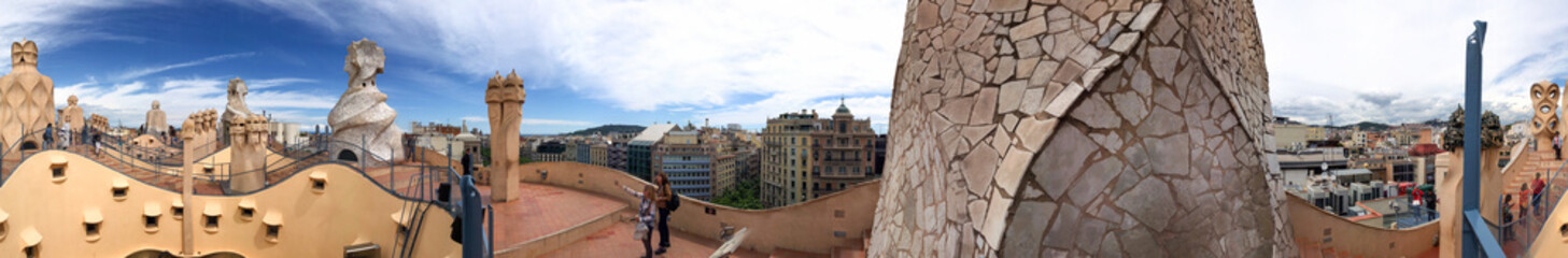 Obraz premium BARCELONA - MAY 14, 2018: Tourists enjoy city view from rooftop. Barcelona attracts 10 million tourists annually