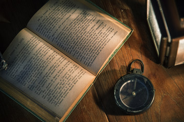 Fototapeta premium An old book on a wooden table
