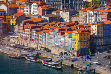Fototapeta na wymiar Panoramic view of Old city of Porto (Oporto) and Ribeira over Douro river, Portugal. Concept of world travel, sightseeing and tourism.