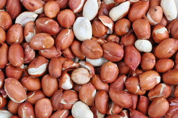 Peanuts are heated microwave oven, so their skins cracked.