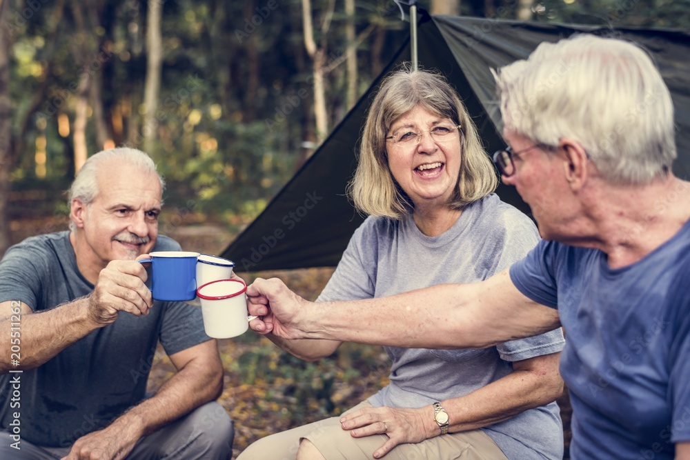 Wall mural friends having coffee at a campsite